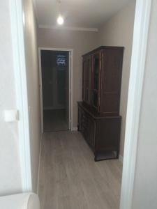 an empty room with a cabinet and a hallway at Private Quiet Place in Dijon