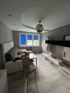 a living room with a couch and a table at U Damiana in Gdańsk