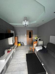 a living room with a couch and a table at U Damiana in Gdańsk