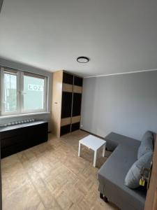 a living room with a couch and a table at U Damiana in Gdańsk