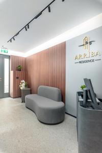 a hospital room with a bed and a tv at Arriba Rooms in Poreč
