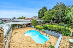 an overhead view of a backyard with a swimming pool at Maroela House Guest Accommodation in Bellville