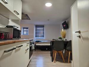 a kitchen and dining room with a table and chairs at Apartment in Vaihingen an der Enz - Ensingen in Vaihingen an der Enz