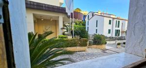 a view from a window of a house with plants at Speloncae Apartment in Sperlonga