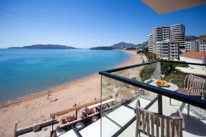 a balcony with a view of a beach at Hotel Aleksandar Rafailovići in Budva