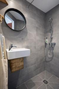 a bathroom with a sink and a mirror at Hôtel Almanarre Plage - Hôtel Eco-Responsable face à la mer in Hyères +39 photos