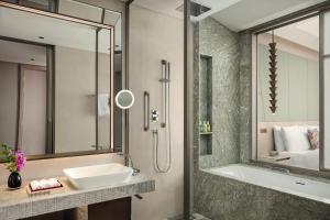 a bathroom with a sink and a shower at W Riyadh - KAFD in Riyadh +54 photos