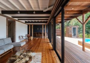 a living room with a couch and a table at 海と森と宿 - mina-to - in Futtsu