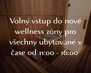 a sign on a door that says yellowiny virus do move wellnessryu wellness at Resort Červený dvůr - apartmány a wellness in Rapotín