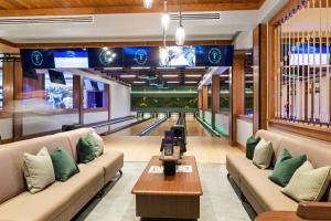 a bowling alley with couches and a bowling alley at OG02: 2 Ocean Green in Kiawah Island
