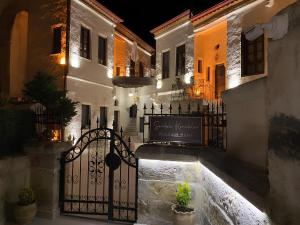an alley with a gate in a city at night at Sevdalı Konakları in Avanos