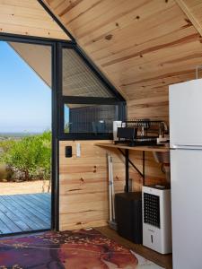 an outside view of a kitchen in a tiny house at Peace Haven @ Windfarm Accommodation in Yzerfontein +77 photos