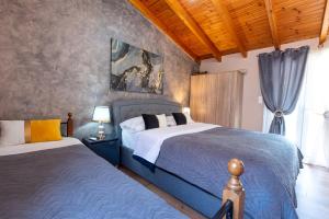 a bedroom with two beds and a window at Dream Houses Near Athens Airport By SEM in Artemida