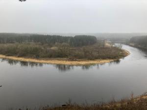 an island in the middle of a river at Balto kalno namai, Kernavėje in Kernavė +1 photo