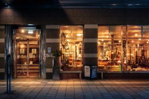 a store front of a building at night at Clarion Hotel Örebro in Örebro