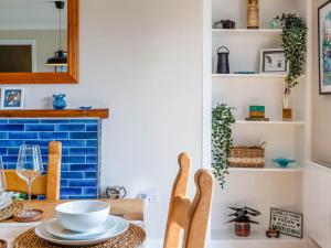 a dining room with a table and chairs at Greenhill in Blackwaterfoot