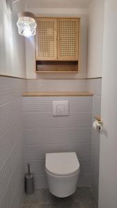 a bathroom with a white toilet in a room at Sur les hauteurs de Collioure in Collioure +16 photos