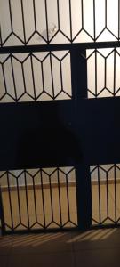 a view of a wall with lines of windows at Johannys'co in Abidjan