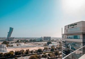 a view of a city with a building at Holiday Inn Abu Dhabi by IHG in Abu Dhabi