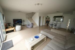 a living room with a couch and a table at Vila Brca in Brca