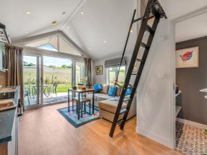 a kitchen and living room with a ladder in a house at Cranbourne Chase Stargazer - Ukc6914 in Pentridge