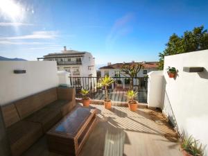 a view from the balcony of a house with plants at Duplex Apartman with sunny terrace in Mijas Pueblo in Mijas