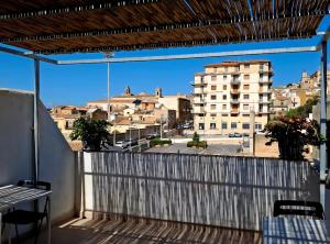 a balcony with a view of a city at A due passi dal centro in Noto