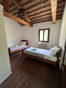 a bedroom with a bed and a couch in a room at Villa Riviera in Mira