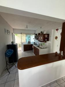 a kitchen with a counter top and a kitchen with a counter top at Casa de las Iguanas Tecolutla in Tecolutla