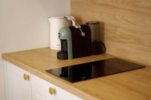 a coffee maker sitting on top of a counter at Not A Hotel Cesis in Cēsis