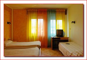 En eller flere senger på et rom på Hotel Ristorante Fratelli Zenari