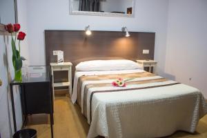 En eller flere senge i et værelse på La Casa de los Faroles