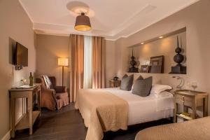 A bed or beds in a room at The B Place