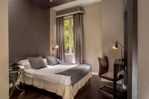 A bed or beds in a room at The B Place