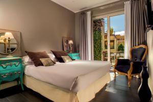A bed or beds in a room at The B Place