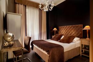 A bed or beds in a room at The B Place