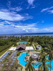 an aerial view of a resort with two swimming pools at Bstan Deluxe Beachfront in Diani Beach