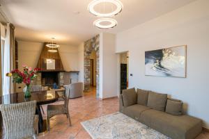 a living room with a couch and a table at Villa Panoramica in Perledo