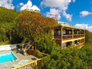a building with a swimming pool and a resort at Marina Vista St. Thomas in St Thomas