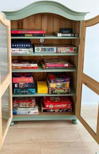 a book shelf filled with lots of books at Modern House In Second Row At Rude Strand in Odder