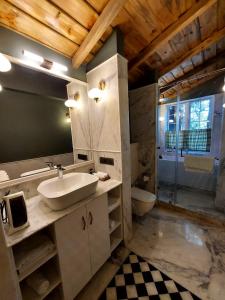 a bathroom with a sink and a toilet at Abbotsford Prasada Bhawan in Nainital +83 photos