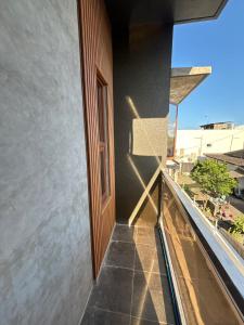 a balcony with a window on a building at R&G Residences in Legazpi