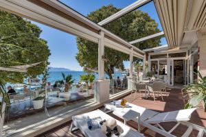a view of the ocean from the patio of a restaurant at Boutique Hotel Marco Polo in Gradac