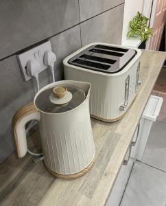 a counter top with a toaster and a toaster at Modern Homes in Stoke on Trent
