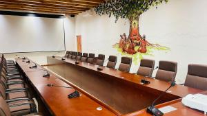 a large conference room with a large table and chairs at Yangkhil Resort in Tongsa