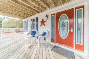 a porch with two chairs and a star on it at Gone With The Wind - Duck, Gull's Flight, 325 Yds to Beach, Pool, Hot Tub, Pets OK, Quiet St, Flex Stays in Duck