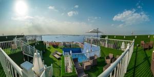 a balcony with a view of a water park at Golden Garden Al Corniche in Dammam