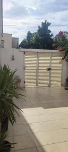 a garage with two large doors on a building at Luxury house in Ariana