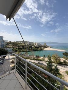 a balcony with a view of the ocean at Beachfront Apartment Saranda in Sarandë