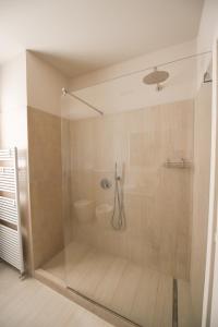 a shower with a glass door in a bathroom at Casa Vacanza Neris in Clusane sul Lago +85 photos